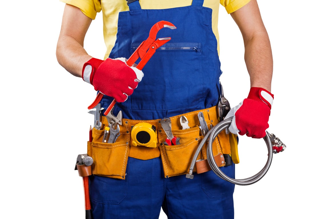 plumber with tool belt isolated on white